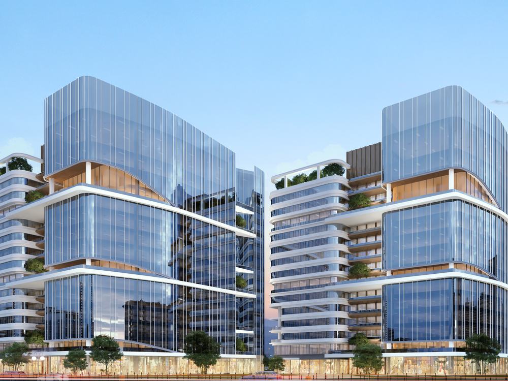 Commercial development designed by AMA, shown at dusk